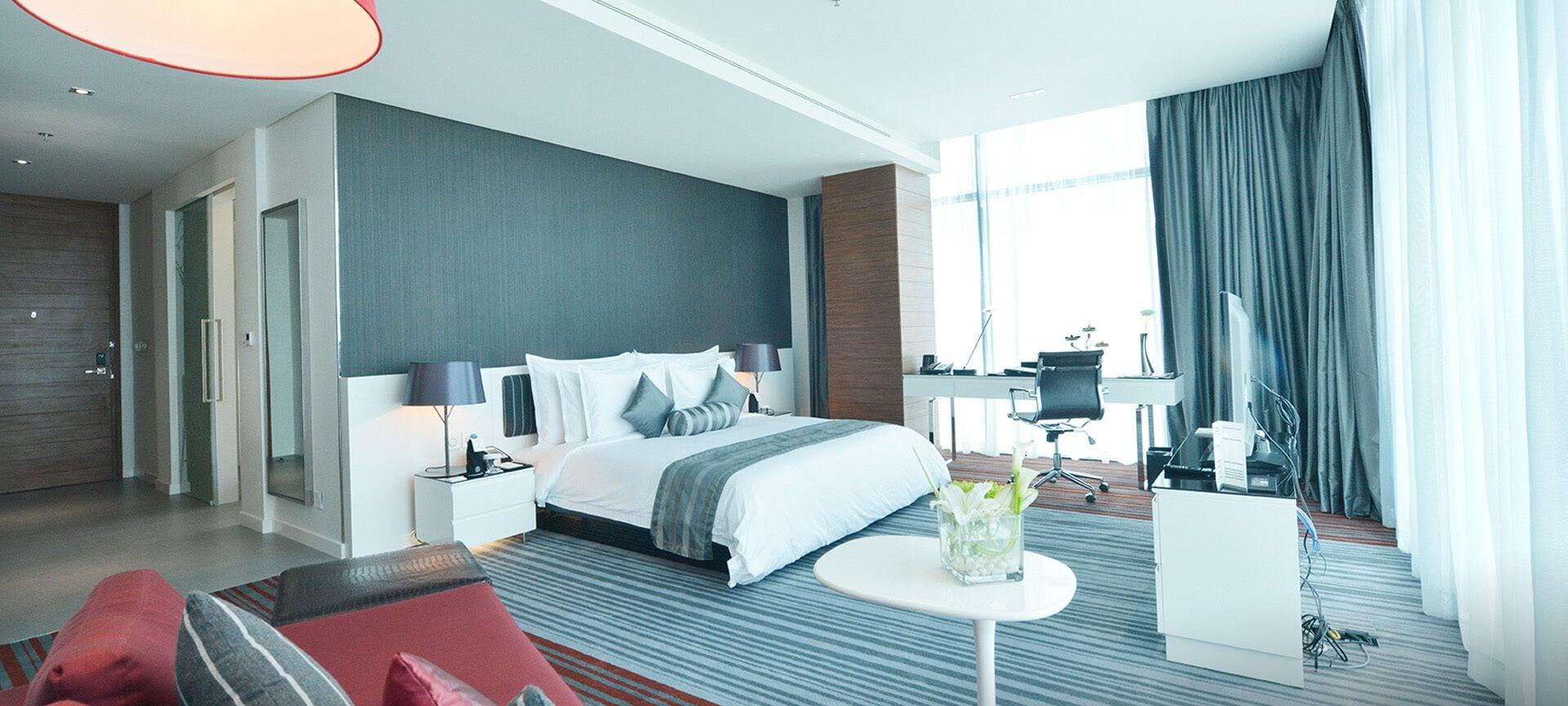 Ramee Grand Hotel And Spa Al Manamah Esterno foto A bedroom in a hotel